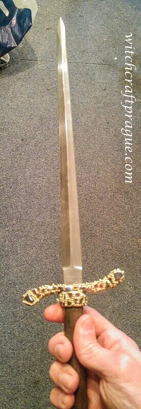 Ritual dagger with emerald gemstones atheme