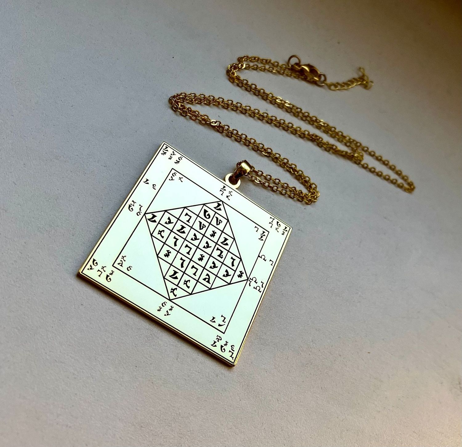 The Enochian lamen of John Dee necklace The Enochian lamen of John Dee necklace, Material: Gold plated