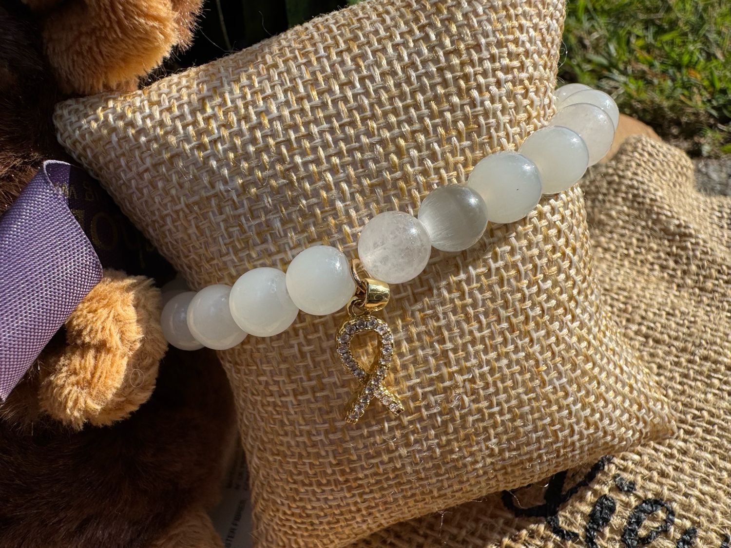 White Jade Awareness Bracelet with Gold Ribbon Charm