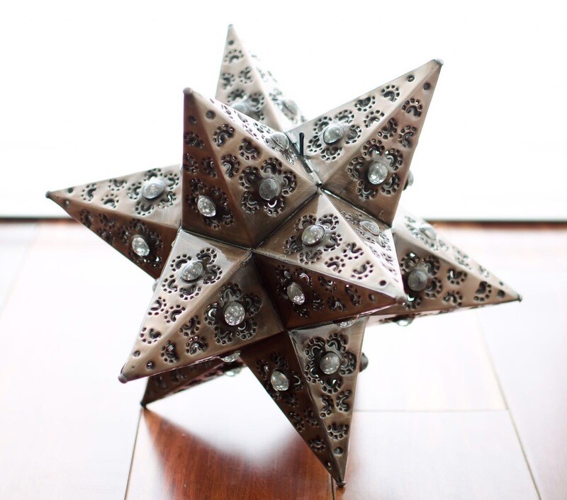 Estrella bronze con canica blanca