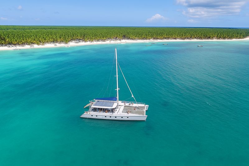 Saona Softness Sailing catamaran on turquoise sea, Saona Softness excursion