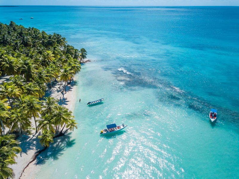 Aerial view of Saona beach and boat at sea