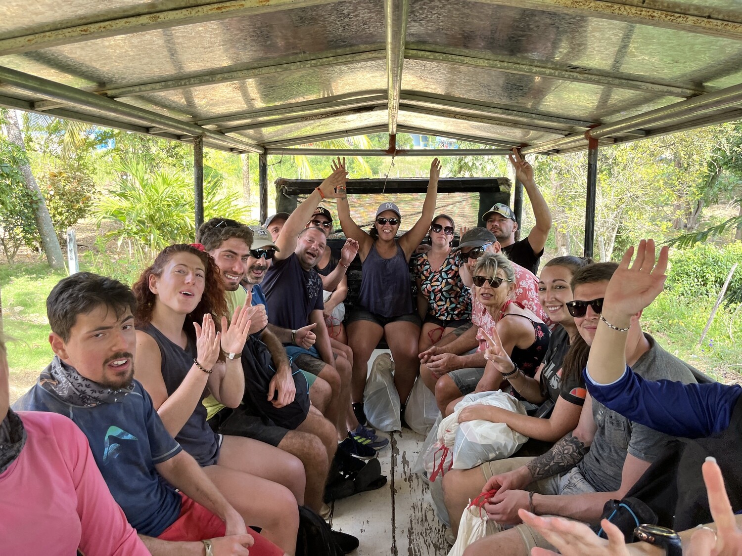 Travelers enjoying the ride in a typical safari truck