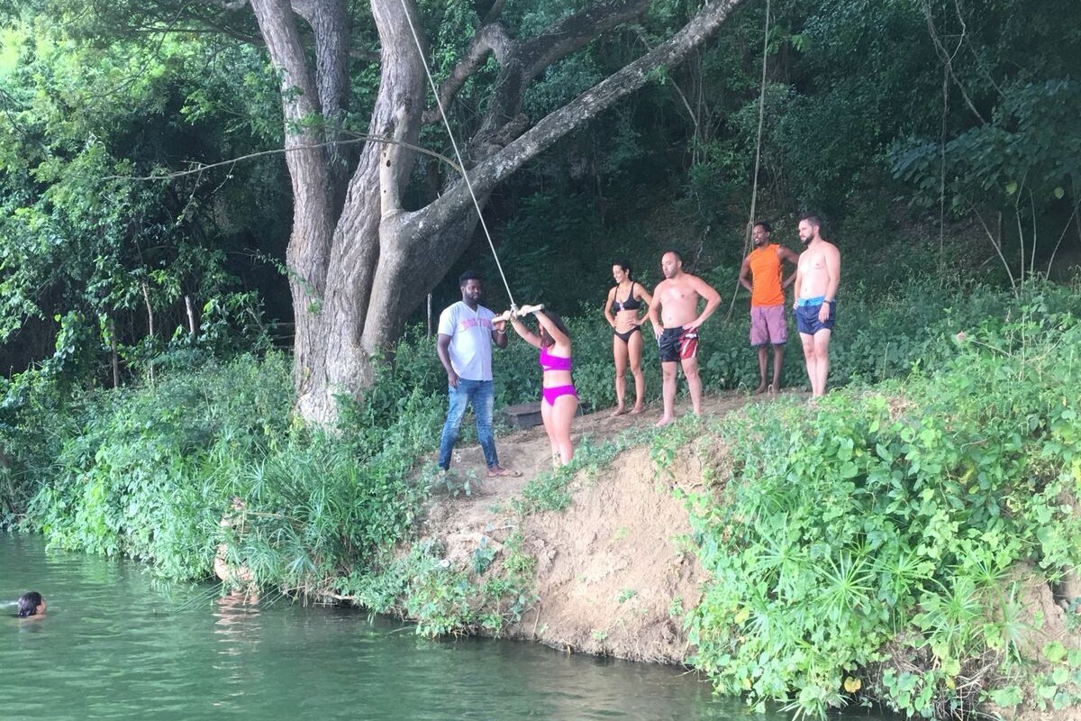 Travelers enjoying a swim in the river during the excursion