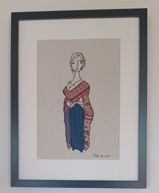 Marianne. Coton brodé et tissus appliqués. Dans un cadre 32,5x42,5 cm.