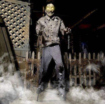 6 ft. Tall Motion-Activated Guard Zombie, Dragging chains, Eyes Light up in yellow LEDs, Premium Halloween Animatronic