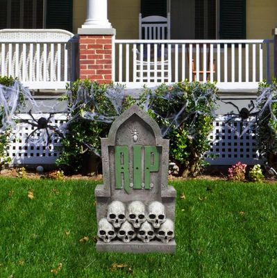 2 ft. RIP Tombstone with Skulls Pre-Lit LED Resin Figurine, Indoor or Covered Outdoor Halloween Decoration, Plug-In PRE ORDER
