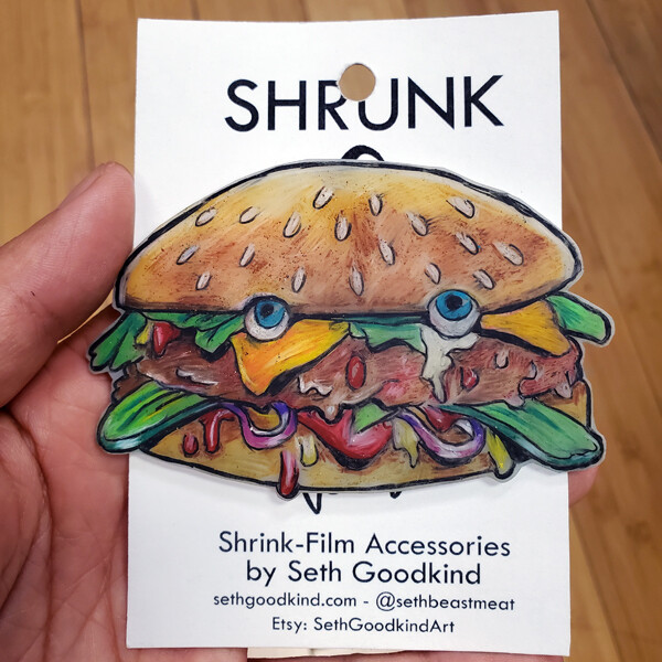 Burger Face Shrinky Dink - Brooch by Seth Goodkind