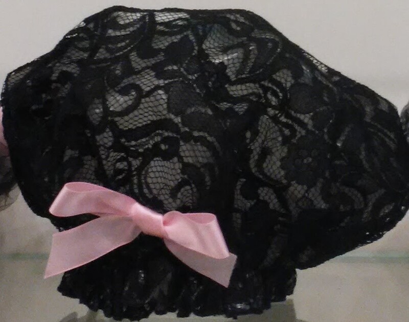 Black lace shower cap with pink satin bow