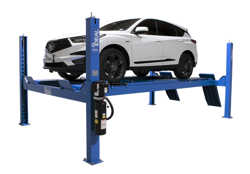 White car situated in a Post Alignment Lift