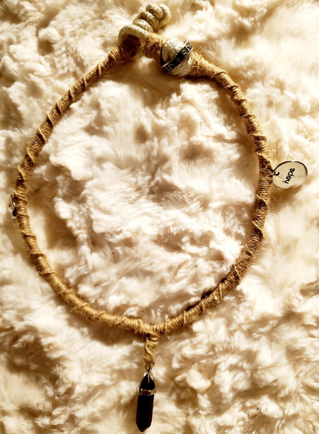 Hemp Necklace with unpolished Amethyst and other pendants weaved into necklace.