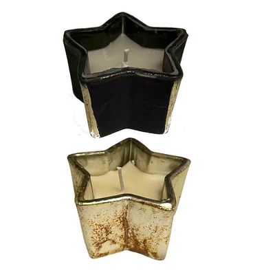 Stervormige glazen kaars van Home Society, verkrijgbaar in zwart of goud.