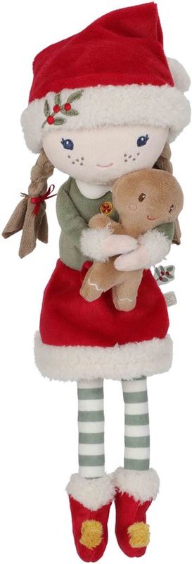 Zachte kerstpop Rosa met rode muts en peperkoekmannetje.