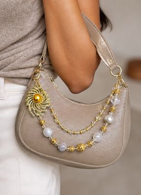 Gold Sunburst Beaded Purse Charm with White Pearl-Like Accents