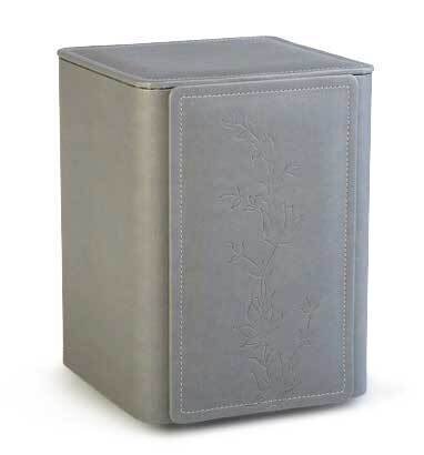 Grey artificial leather cinerary urn with flower decoration