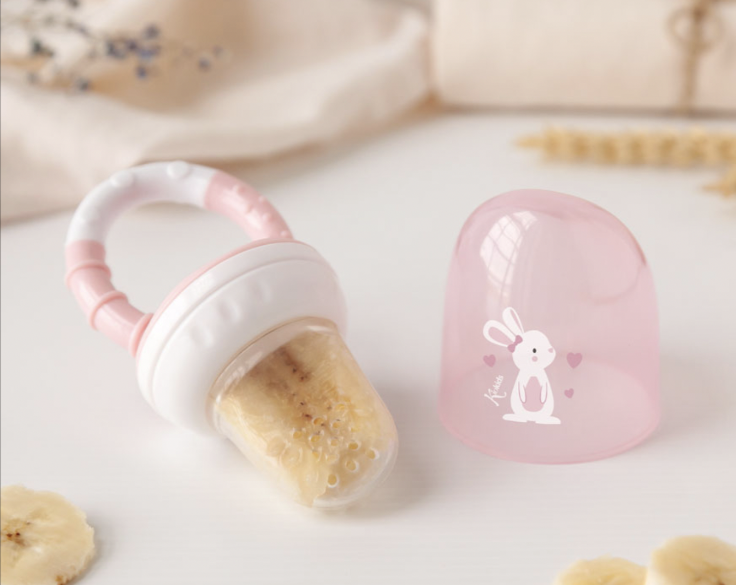 Kiokids Alimentador antiahogo en silicona rosa