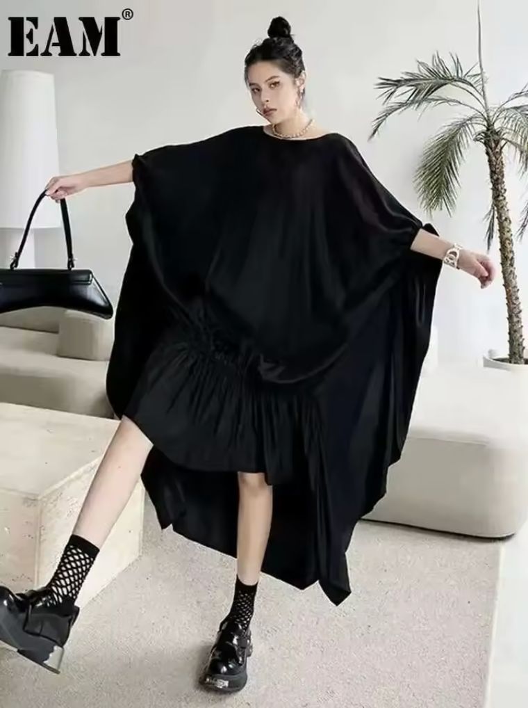 EAM Women Black Pleated Irregular Big Size Long Dress New Round Neck Half Sleeve Fashion Tide Spring Summer 2025 1DH6284