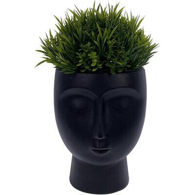 Escultura con planta