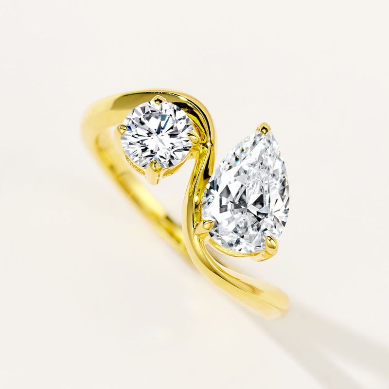 Two stone bond ring