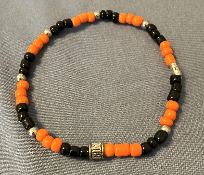 Black and Orange Seed Bracelet with Gold Accent