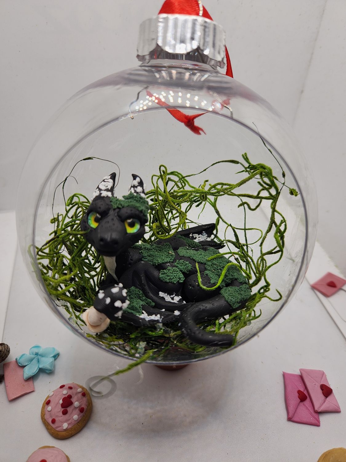 Forest dragon in hanging terrarium