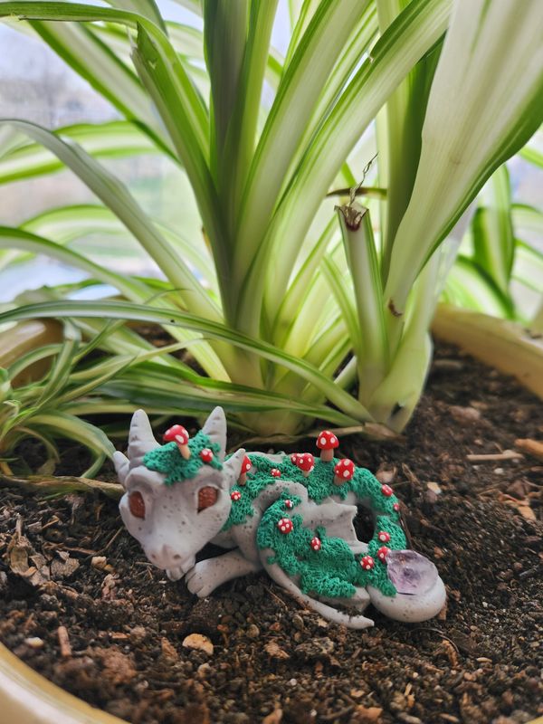 Granite scale dragons with moss and mushrooms