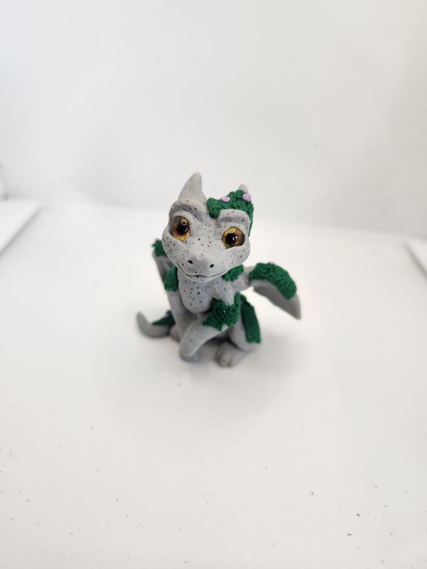 Granite scale dragons with moss and mushrooms