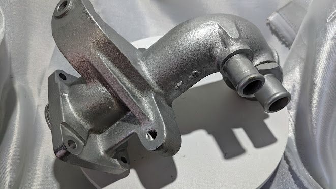 LATE Rolls Royce Silver SPUR front water pump pipe outlet to housing UE74755