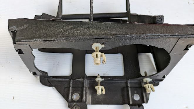 FERRARI 456M LEFT HEADLIGHT CARRIER 65412500