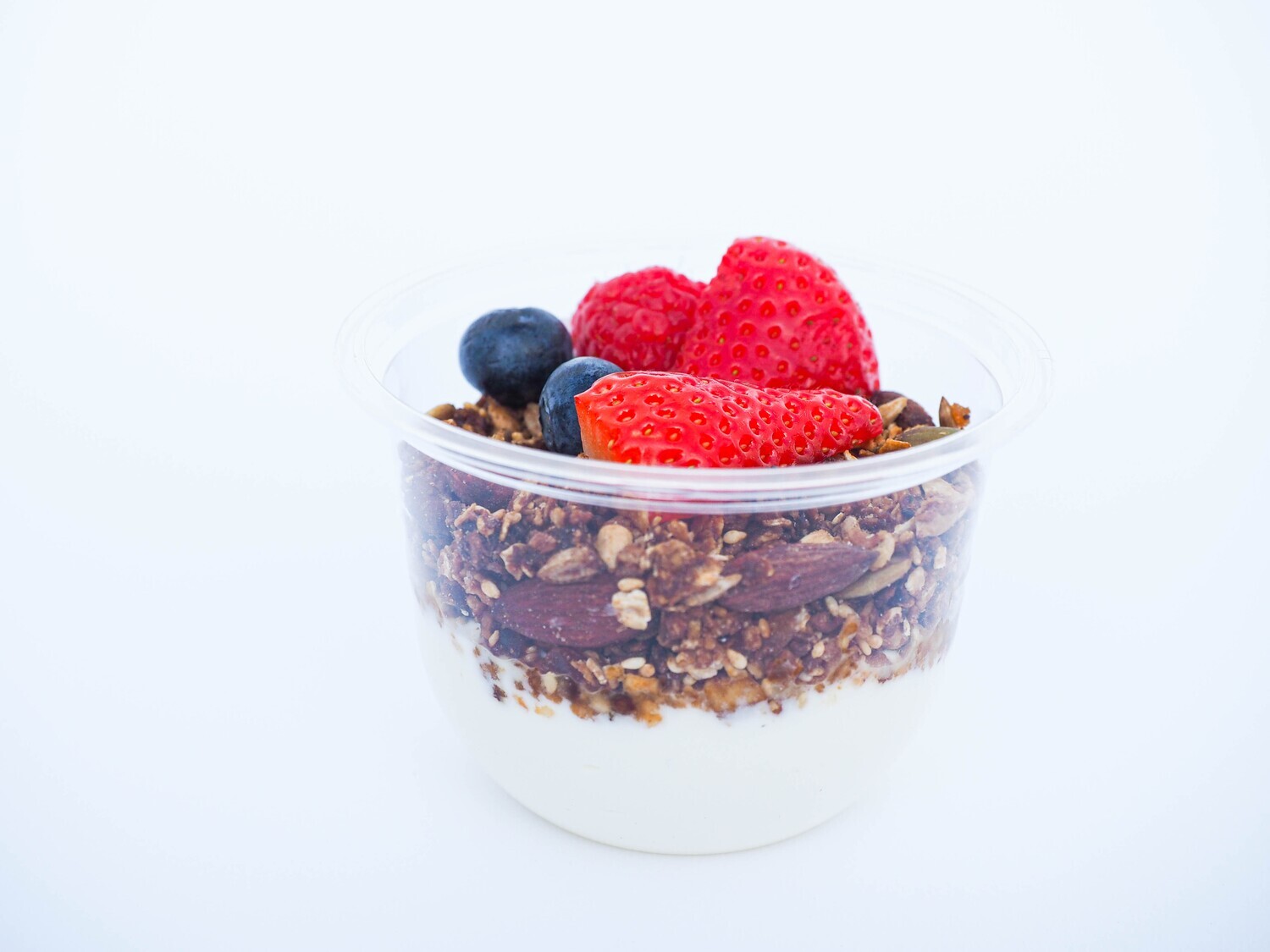 Coconut yogurt pots with granola and berries