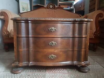 Оld chest of drawers made of solid wood