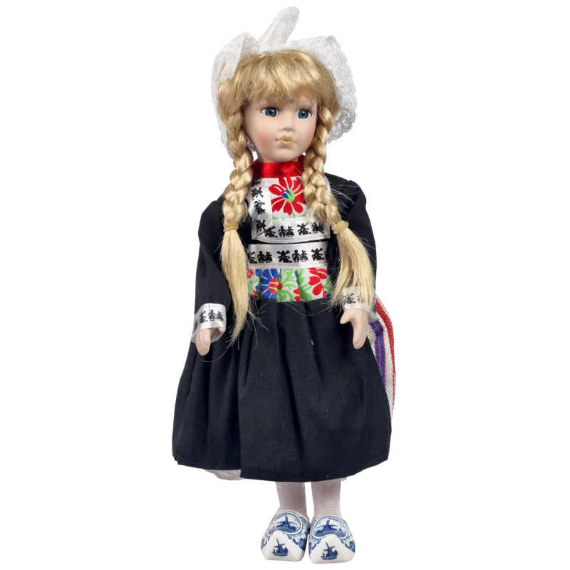 Porseleinen Pop met zwart schort 30 cm