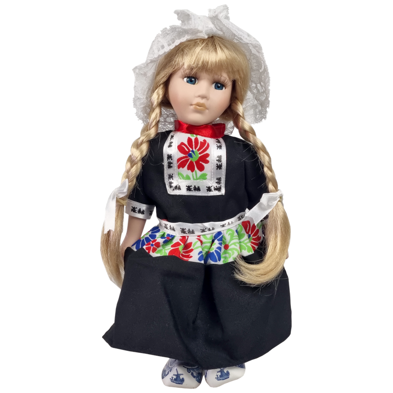 Porseleinen Pop met zwart schort 25 cm