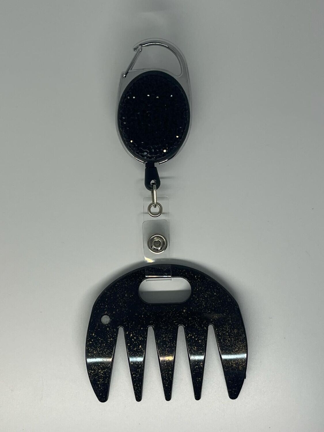 Grat-grat noir moucheté or,  clipper diamants noirs dans son coffret cadeau.