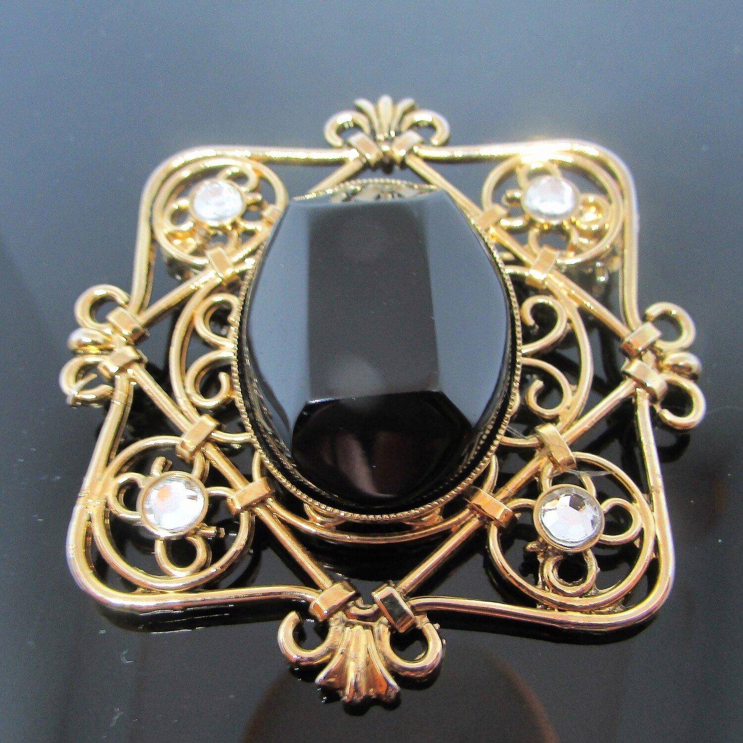 Gold and Noir Brooch with Rhinestone accents c. 1980's