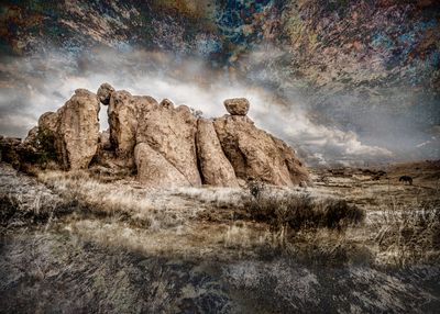Artwork landscape photograph depicting strangly shaped rocks with a mystical sky, made by Françoise Vaal