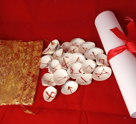 Runes with golden Bag and Casting Instructions- interpretations in seashells, a celtique gift