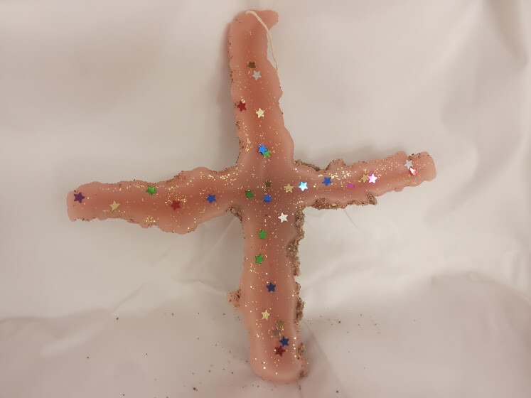 Handmade unique cross, made by sand and  wax.