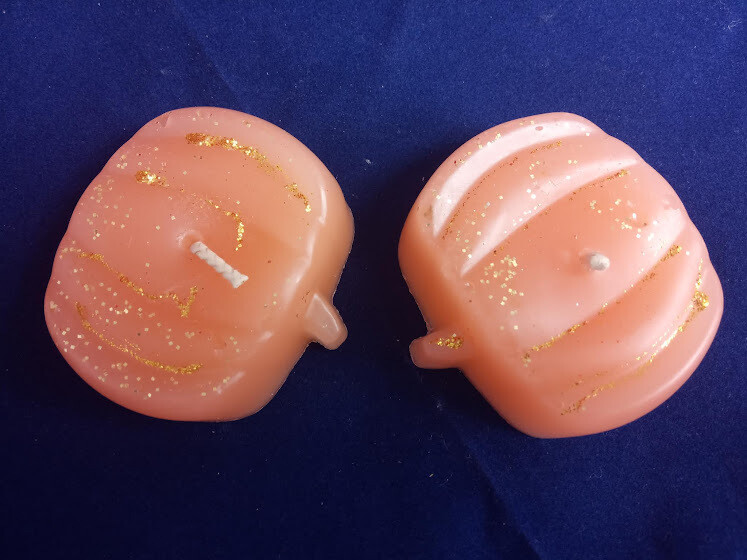 Two pumpkin candles