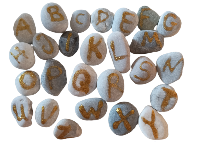 Alphabet in sea stones