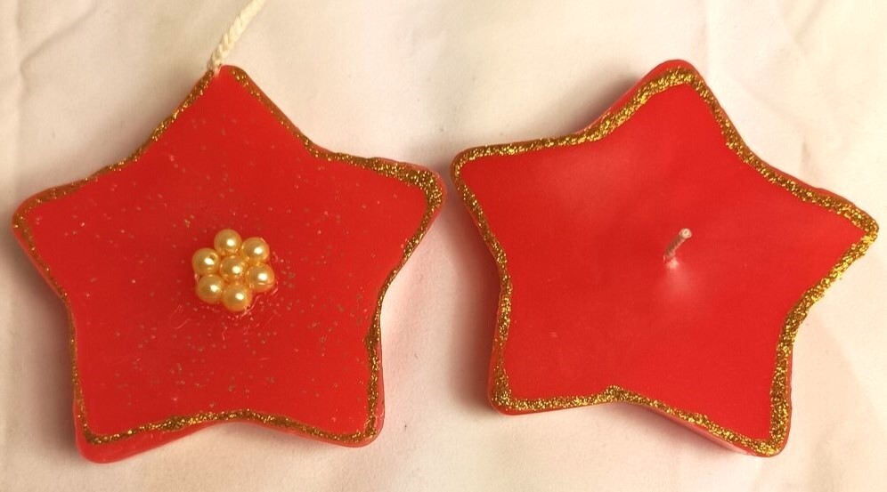 Two Handmade star festive candles