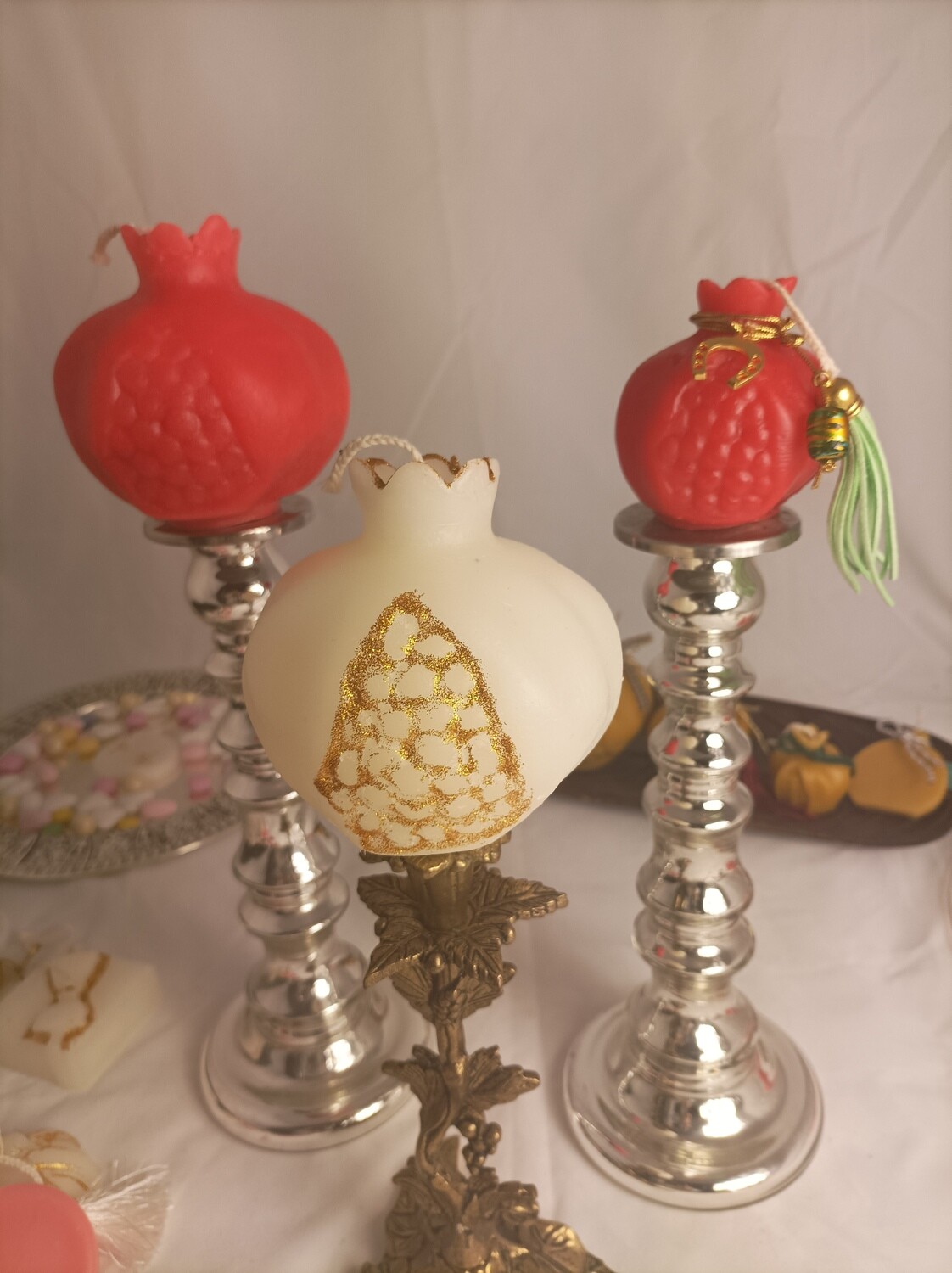Set of three decorative pomegranate candles