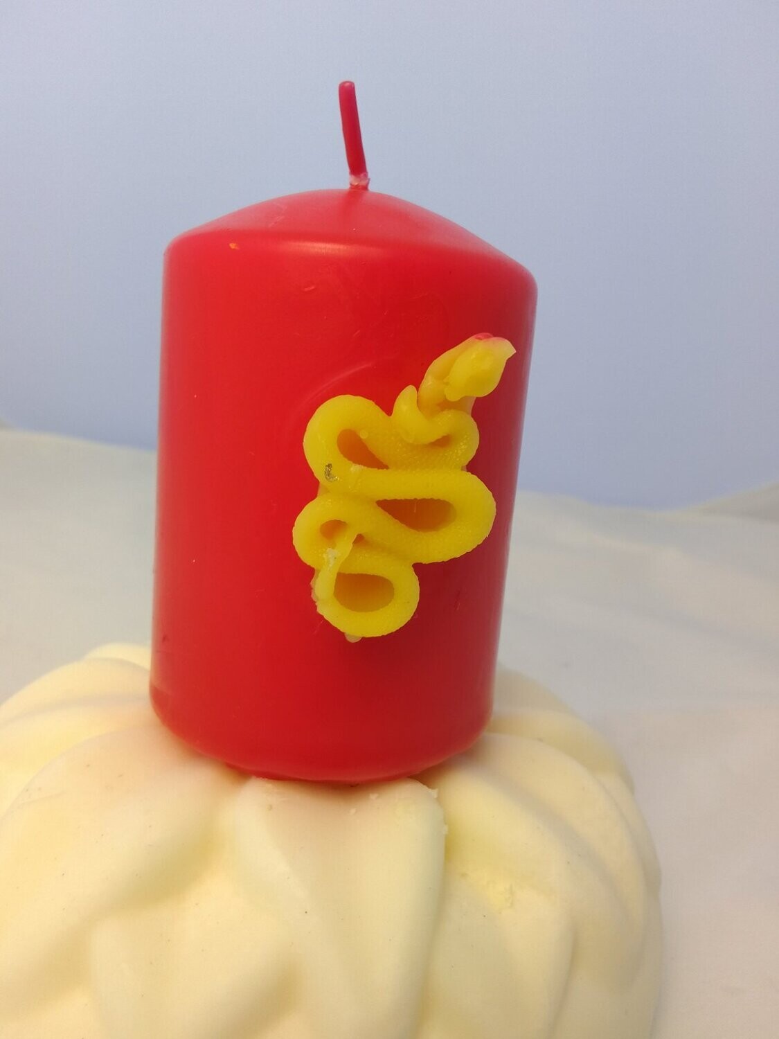 Candle with beeswax snake
