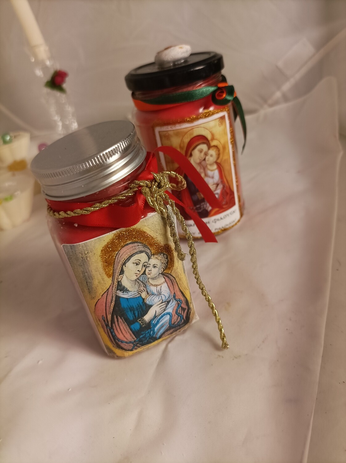 Handmade religious candles, in two jars