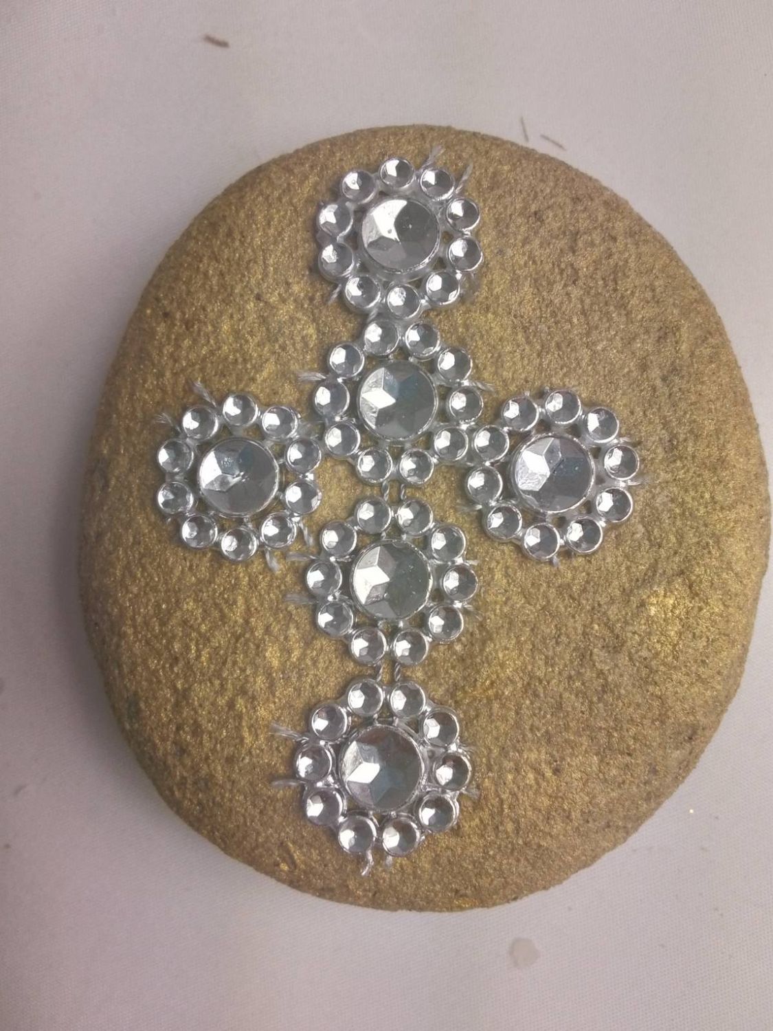 Cross in a big sea stone