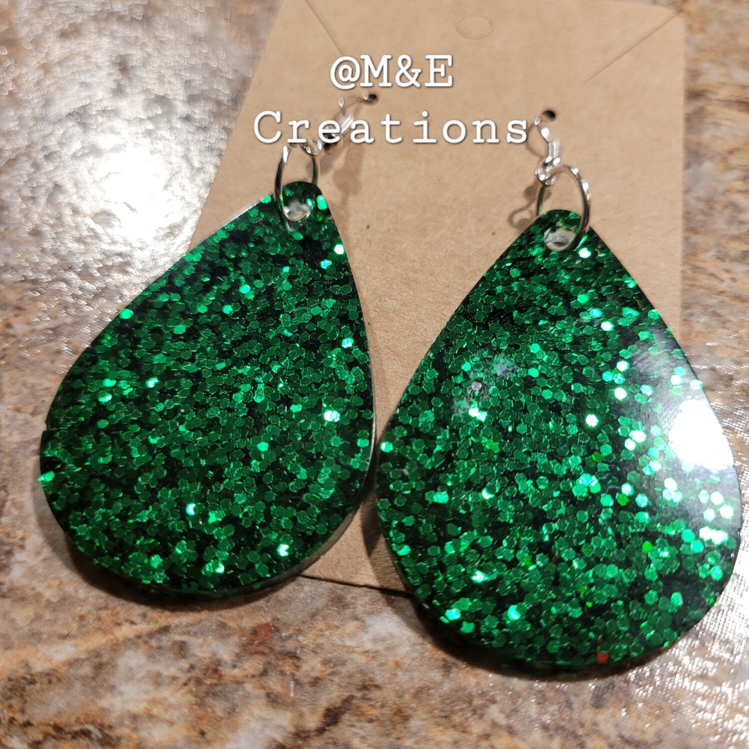 M&E Creations resin green glitter earrings