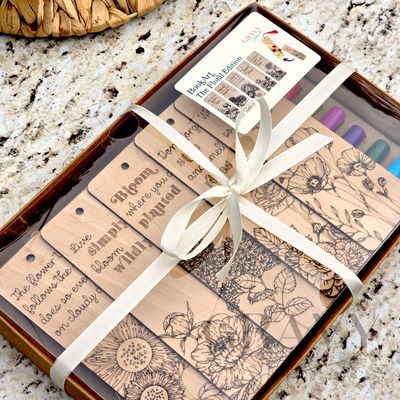 a packaged set of 5 wooden bookmarks