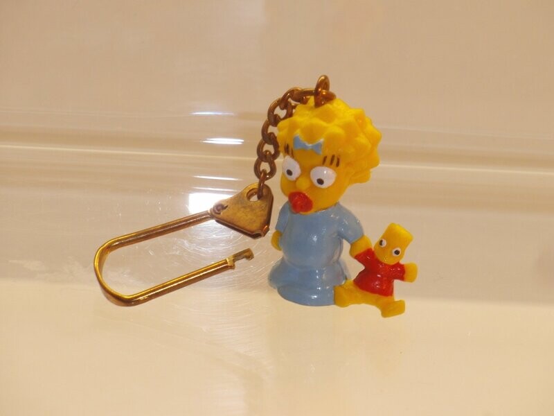 The Simpsons: Bully 1991: Maggie (Schlüsselanhänger) The Simpsons: Bully 1991: Maggie (Schlüsselanhänger)