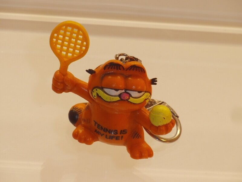 Garfield: Bully: Garfield als Tennisspieler (Schlüsselanhänger) Garfield: Bully: Garfield als Tennisspieler (Schlüsselanhänger)
