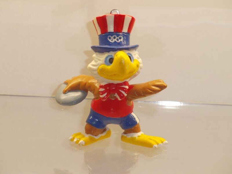 Werbefiguren: Olympische Spiele Los Angeles 1984: Maskottchen Sam als Diskuswerfer (fehlende Schlüsselkette)